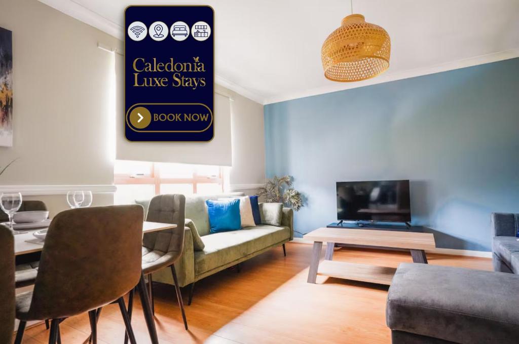 a living room with a couch and a table at Coat Apartment in Coatbridge