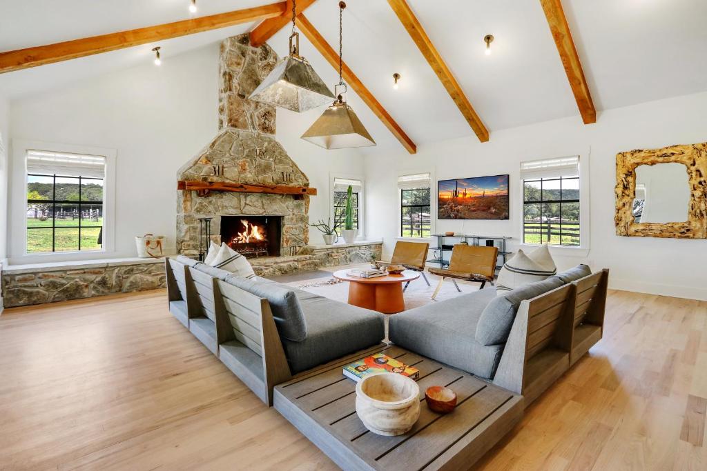 a living room with a couch and a fireplace at D2 Farms in Wimberley
