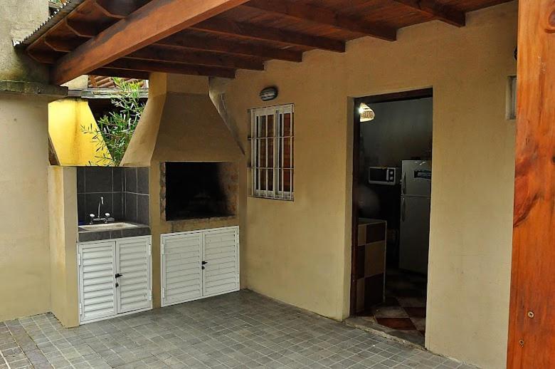a kitchen with white cabinets and a kitchen with a sink at Cabañas Balboa in Costa del Este