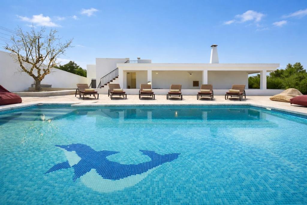 a swimming pool with a shark painted on it at Can Catalina in Can Furnet