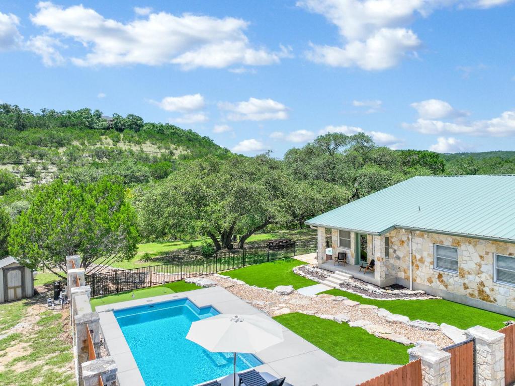 an aerial view of a house with a swimming pool at Artista in Wimberley