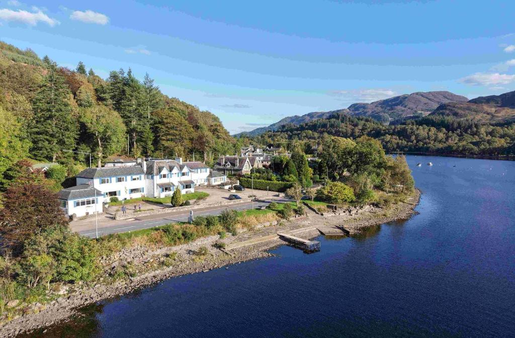 an aerial view of a town next to a lake at The Four Seasons Hotel in Saint Fillans