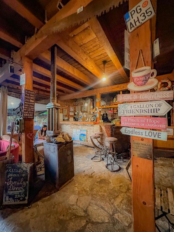 a room with a stove and signs on the wall at Hostel Anton in Tivat