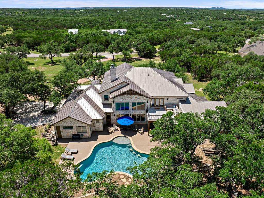 an aerial view of a house with a swimming pool at Big Red Chicken Estate in Wimberley