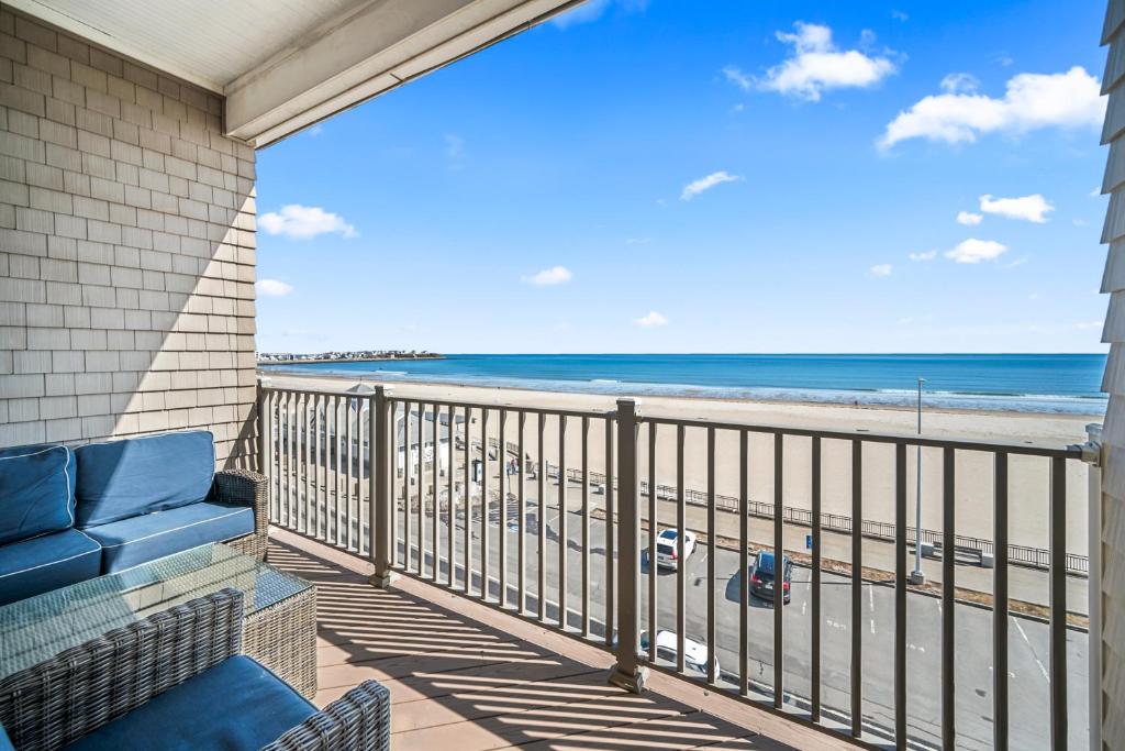 a balcony with a view of the beach at Hampton Beach OCEAN FRONT Condo at the Surf in Hampton