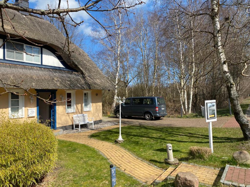 a van parked in front of a house at Ferienhaus Prerow an der Stems in Prerow