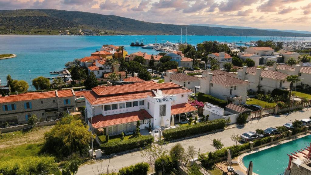 an aerial view of a town next to a body of water at Venezia Alaçatı in Yumru