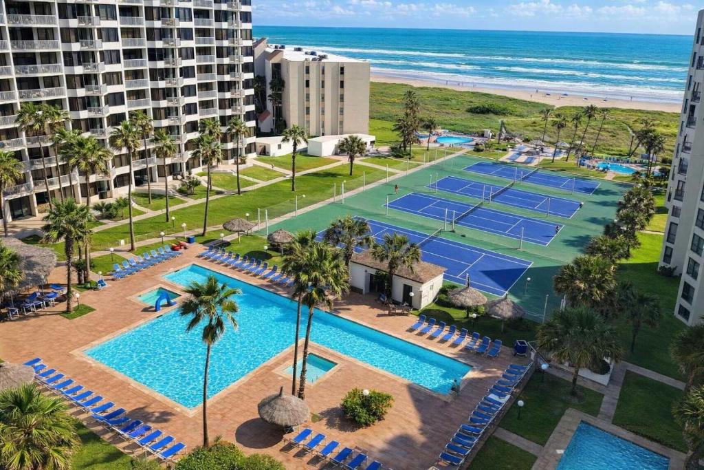 an aerial view of the tennis courts at the beach at Saida Towers IV #108 condo in South Padre Island