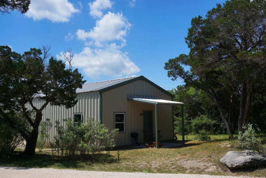 a large building with trees in front of it at Lavender in Wimberley