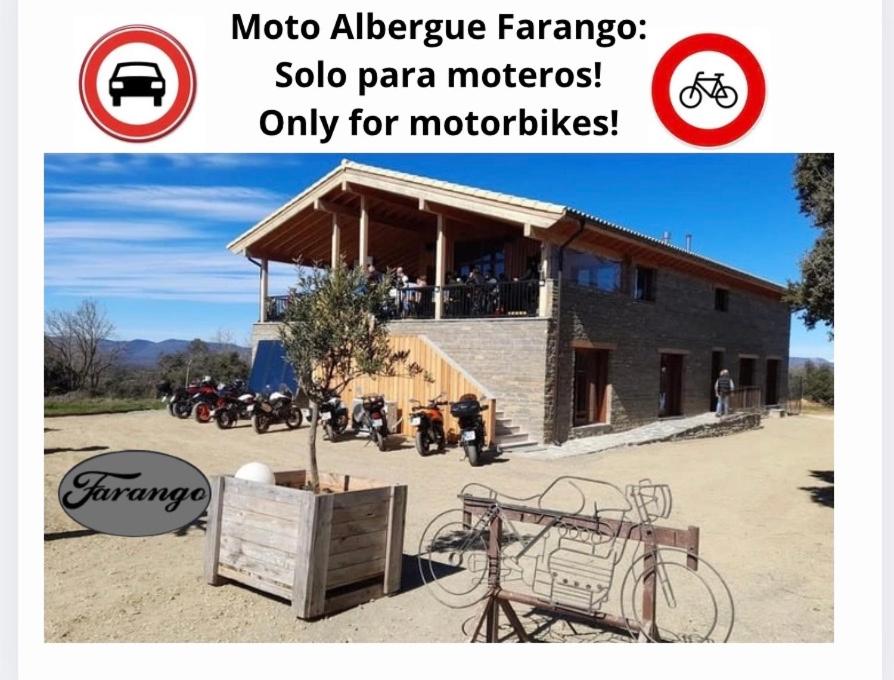 a picture of a house with a group of motorcycles at Moto Albergue Farango FOR MOTORBIKERS ONLY - SOLO PARA MOTEROS in Benabarre