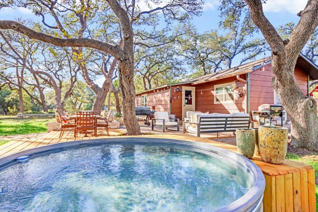 a large swimming pool on a deck next to a house at Lawlis Lodge in Wimberley