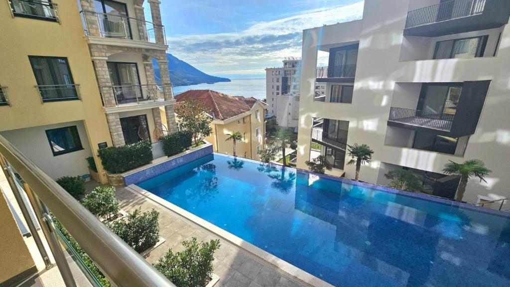 an overhead view of a swimming pool in a building at Montenegro Royal 2 Bedroom Apartment in Bečići