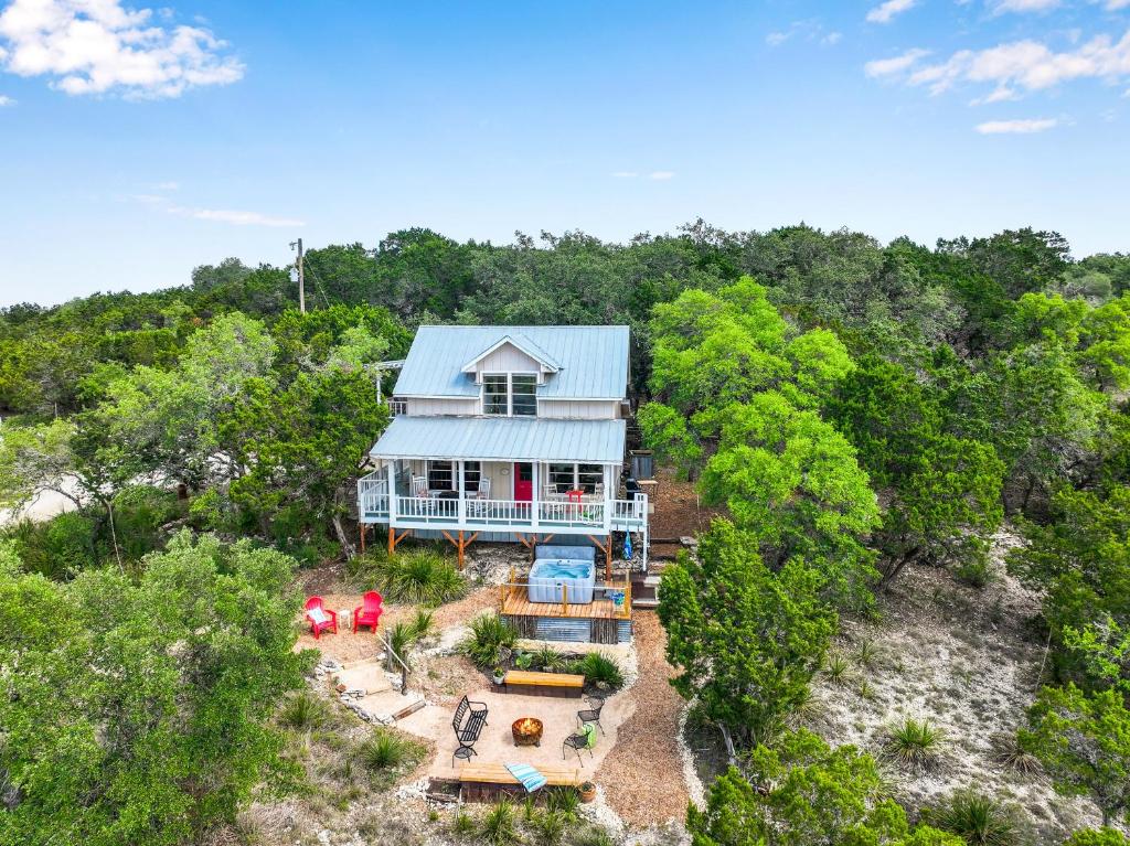 an aerial view of a house in the woods at Lomax Lookout in Wimberley