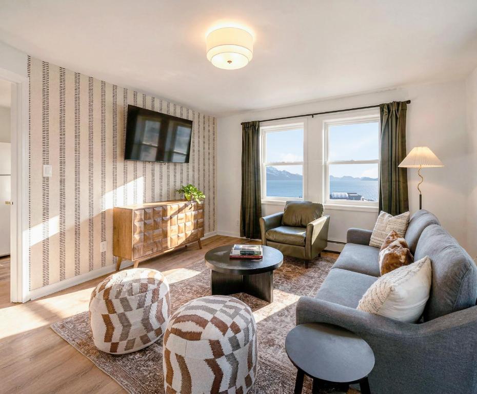 a living room with a couch and a table at Hotel North in Seward