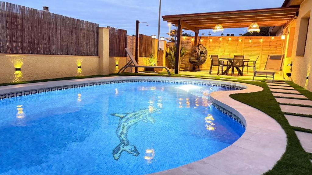 a swimming pool with a shark painted on it at Casa La Gavina in Riumar