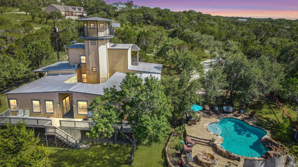 an aerial view of a house with a water park at Canyon Lake Lighthouse in Canyon Lake