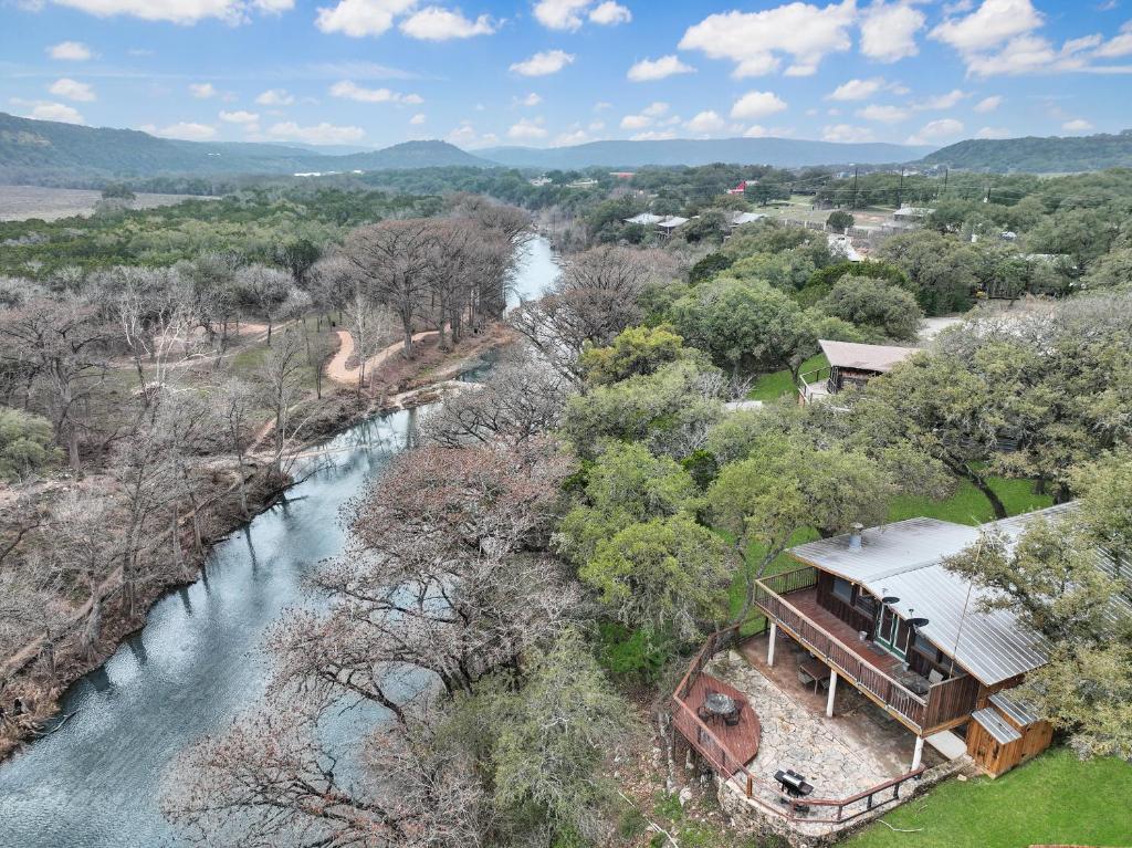 an aerial view of a house next to a river at Ricks River Haus in Canyon Lake