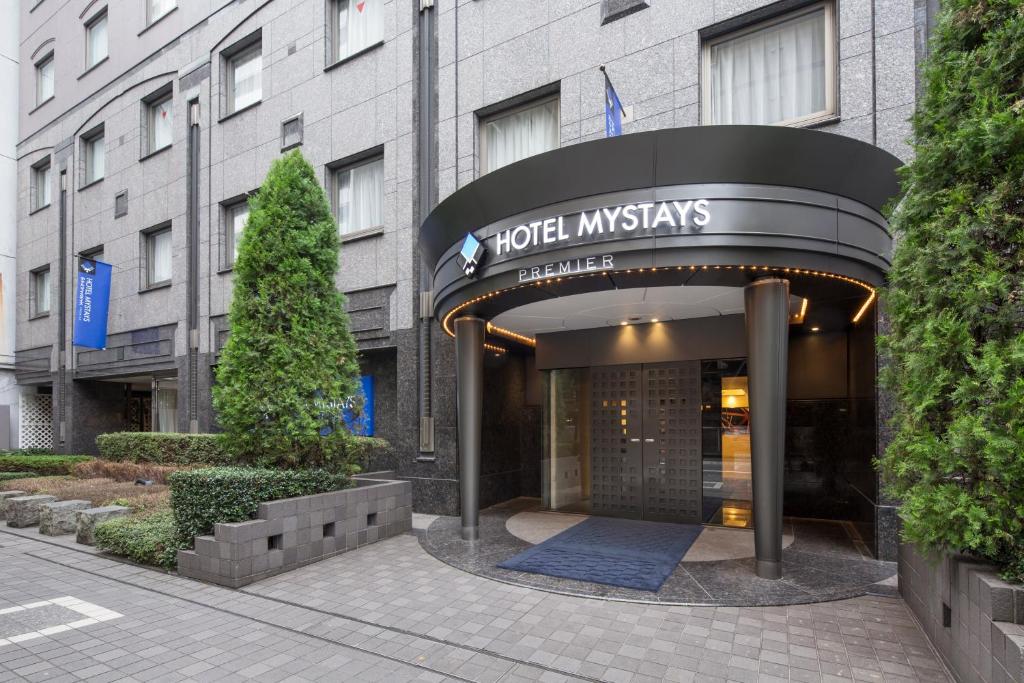 a large building with a clock on the front of it at Hotel Mystays Premier Hamamatsucho in Tokyo