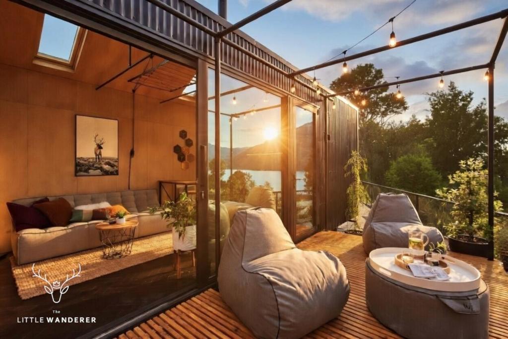 a living room with a couch and a table at The Little Wanderer in Queenstown