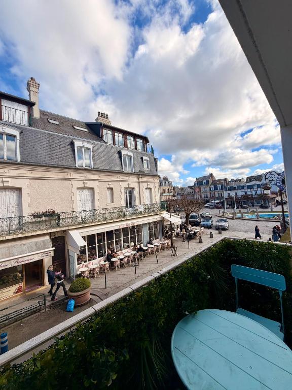 a view from a balcony of a street with buildings at Le Studio Morny in Deauville