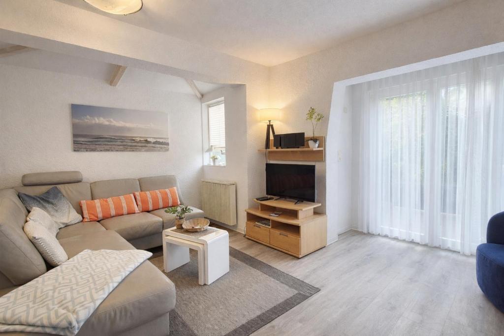 a living room with a couch and a table at Fewo Luv in Kühlungsborn