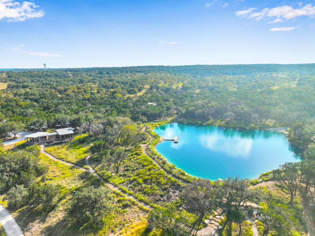 an aerial view of a lake in the woods at Wild Candy-Fruit Tramp in Wimberley