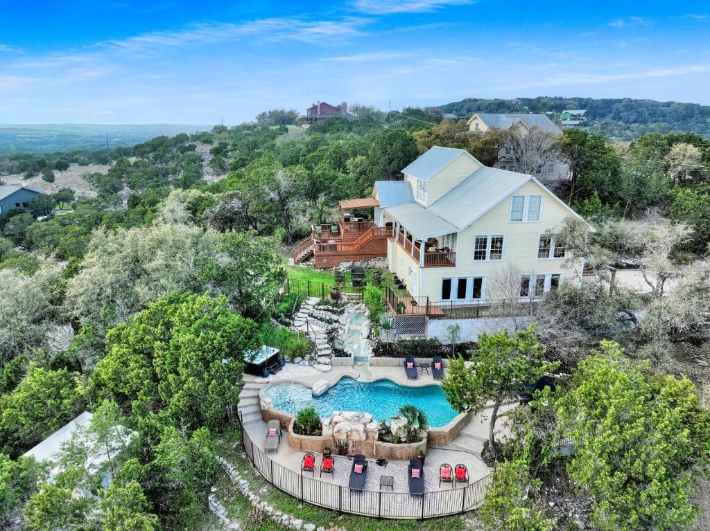 an aerial view of a house with a swimming pool at Whispering Ridge Ranch in Wimberley