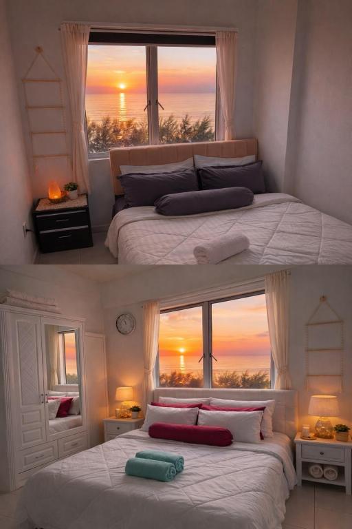two beds in a bedroom with a view of the ocean at Seaview Turtle Cove in Kampong Bugis