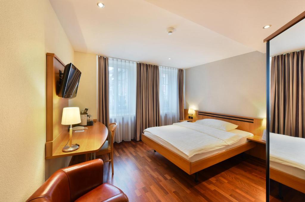 Postel nebo postele na pokoji v ubytování Apart Hotel Amadeo