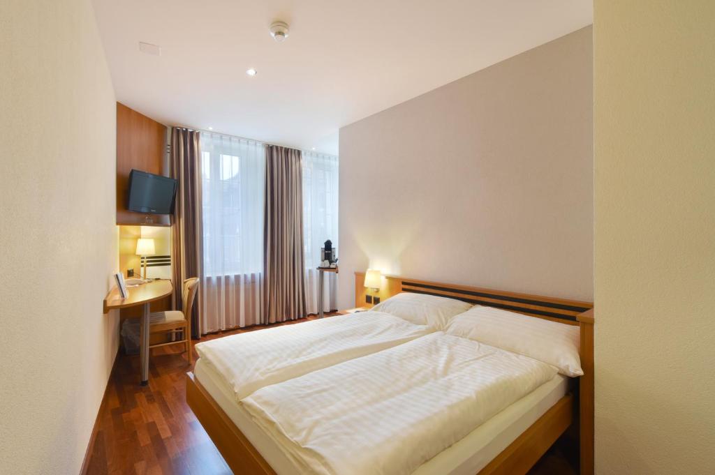 Postel nebo postele na pokoji v ubytování Apart Hotel Amadeo