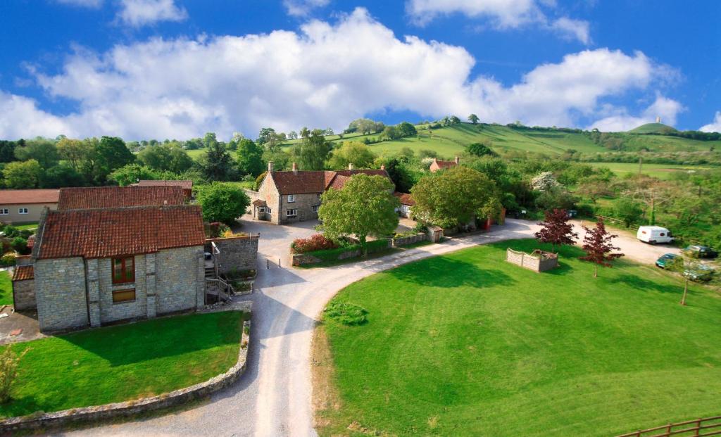 an aerial view of a house with a yard at Middlewick Holiday Cottages in Glastonbury