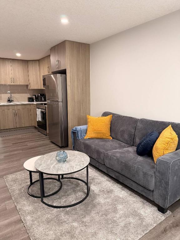 a living room with a couch and a table at Cozy and comfortable in Calgary
