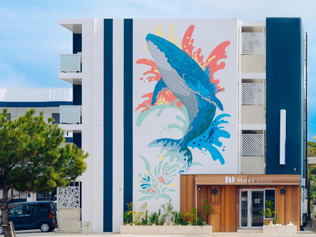 a mural of a fish on the side of a building at メーアレジデンスホテル 宮古空港前 - Meer Residence Hotel Miyako Airport - in Miyako-jima