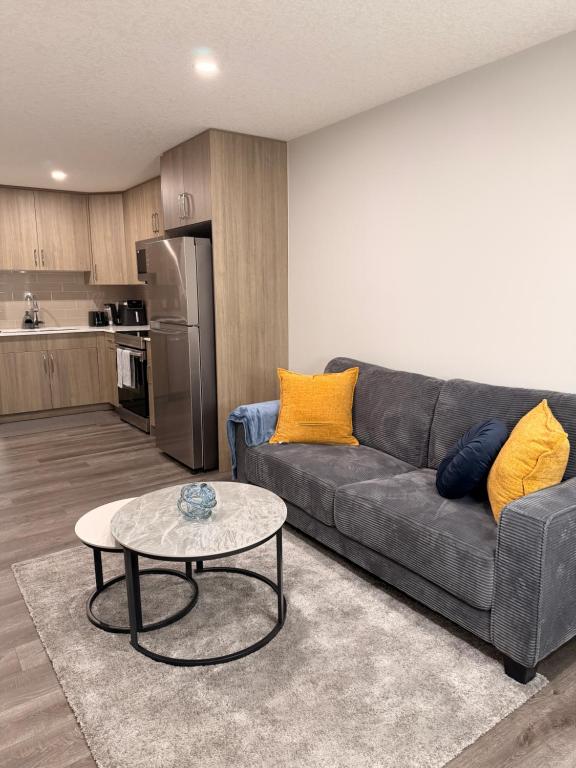 a living room with a couch and a table at Casa Gabriel in YYC