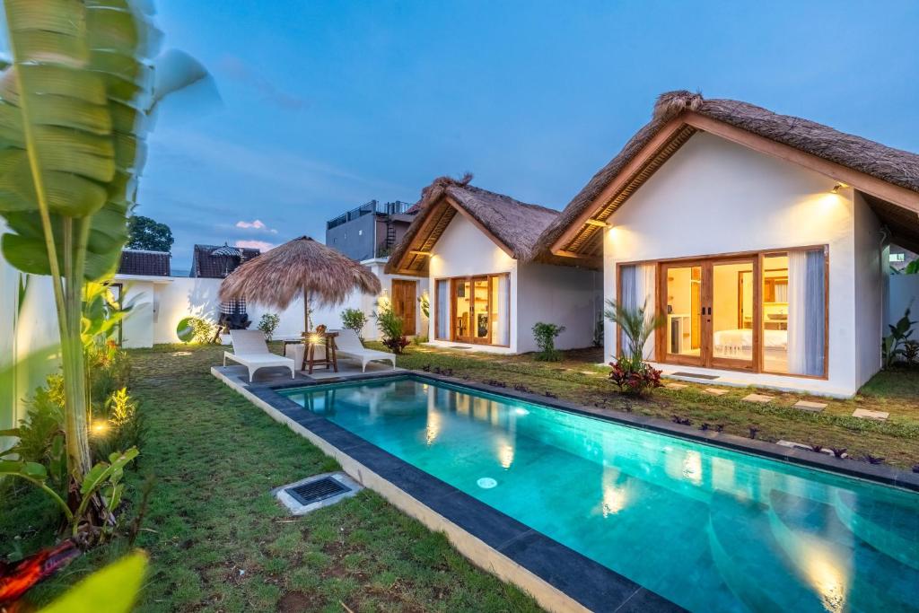 an image of a villa with a swimming pool at LYS Home in Jimbaran
