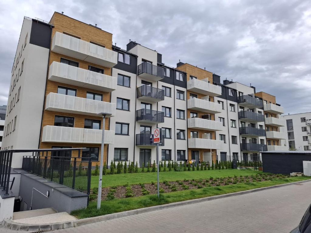 a large apartment building on the side of a street at Sielawy Apartament in Poznań
