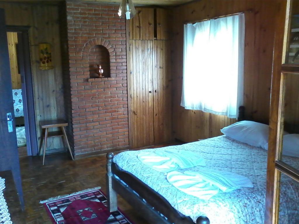 Postel nebo postele na pokoji v ubytování Chalés Dona Zenta