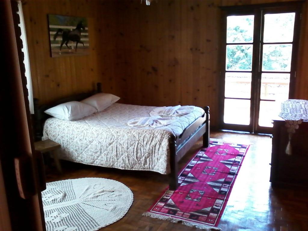 Postel nebo postele na pokoji v ubytování Chalés Dona Zenta