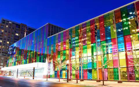 a large building with a brightly colored facade at Testing in Montreal