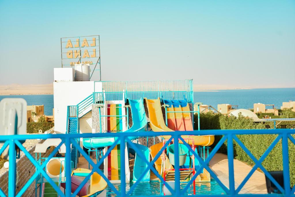 a group of colorful slides on a balcony at LALA LAND Fayoum in Tunis