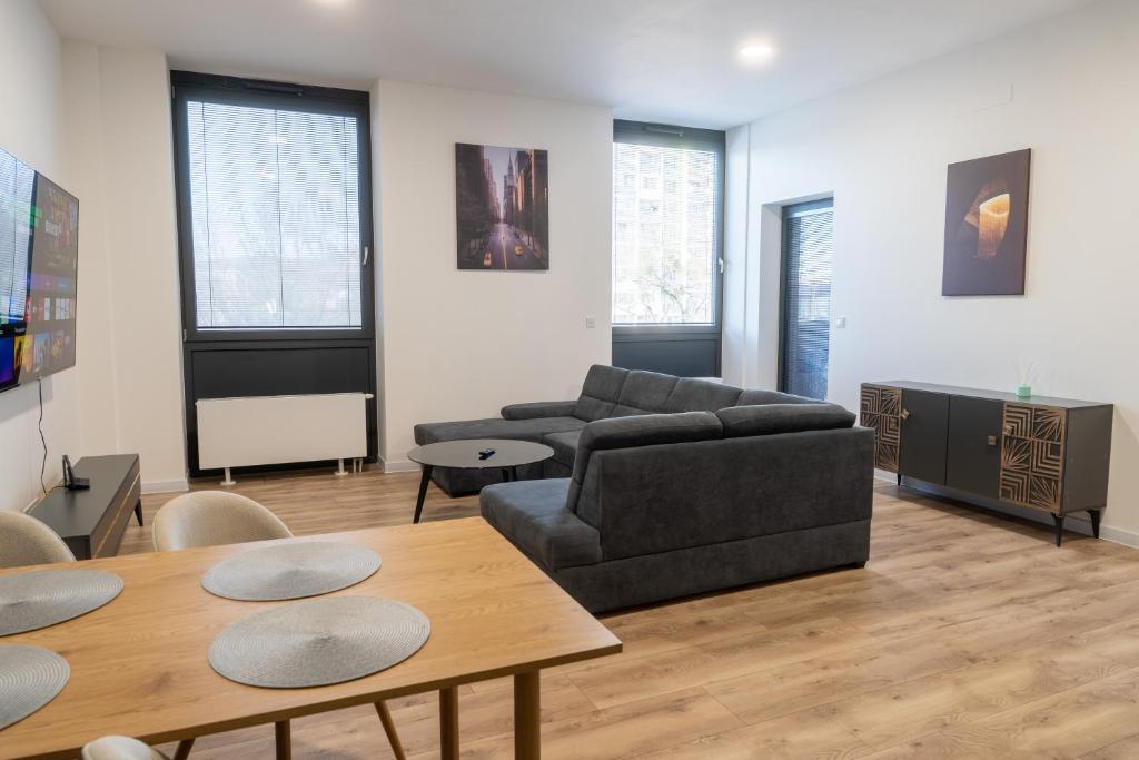 a living room with a couch and a table at Top Apartmán v Central Point Humenné M in Humenné