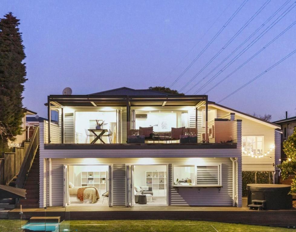 a house with a view of the back of it at Riverside Retreat with River views in Auckland