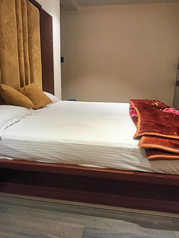 a close up of a bed in a room at Narayan resort and restaurant in Aklera