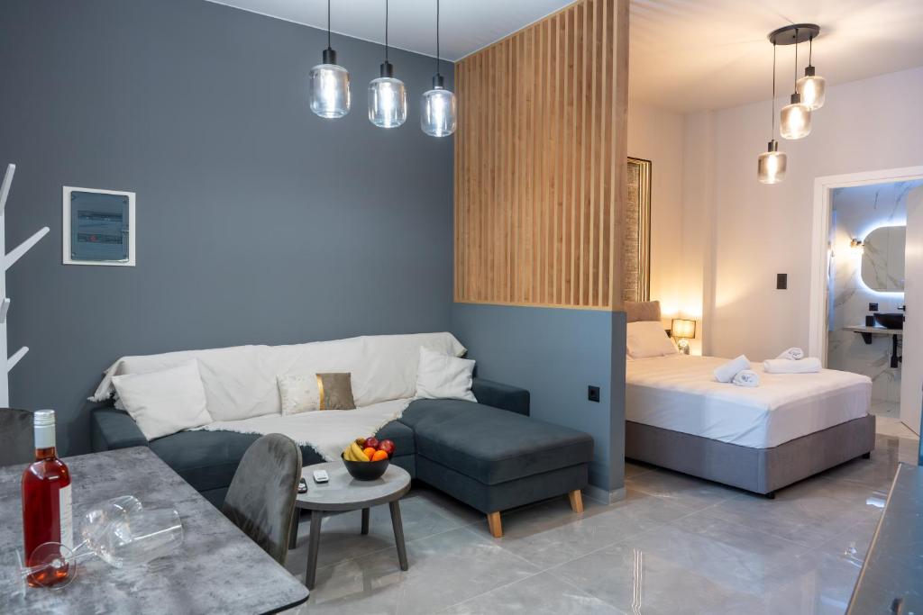 a living room with a bed and a couch at Linea Nest Studio Near the Beach in Pissidhón