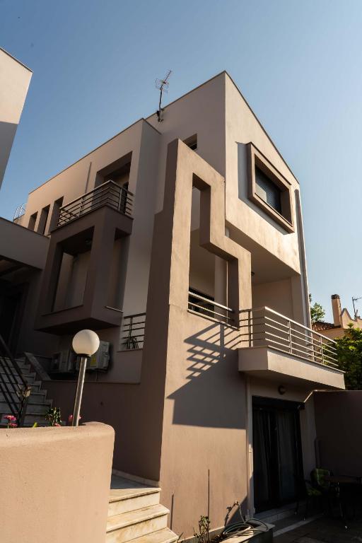 a building with balconies on the side of it at Venetia Luxurious Villa in Iraklitsa