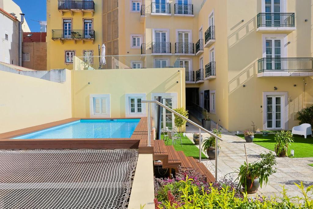 a view of the courtyard of a building with a swimming pool at TM Luxury Apartments Lisbon in Lisbon