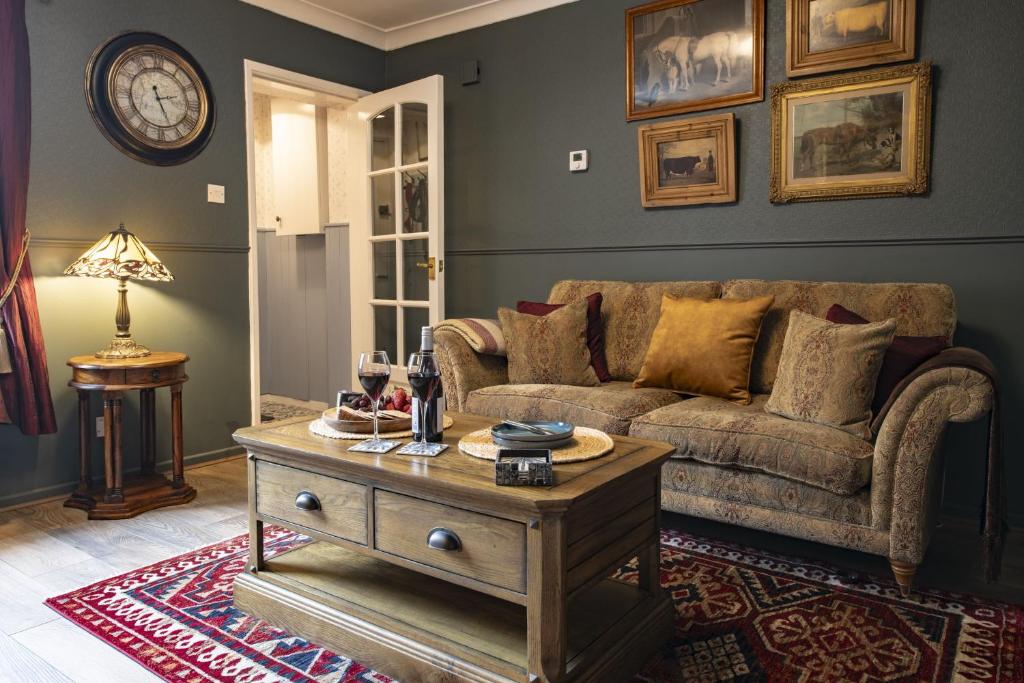 a living room with a couch and a coffee table at Boar Edge Cottage in Richmond