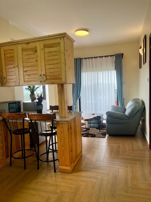 a living room with a couch and a table at Ibis Stays in Naziba