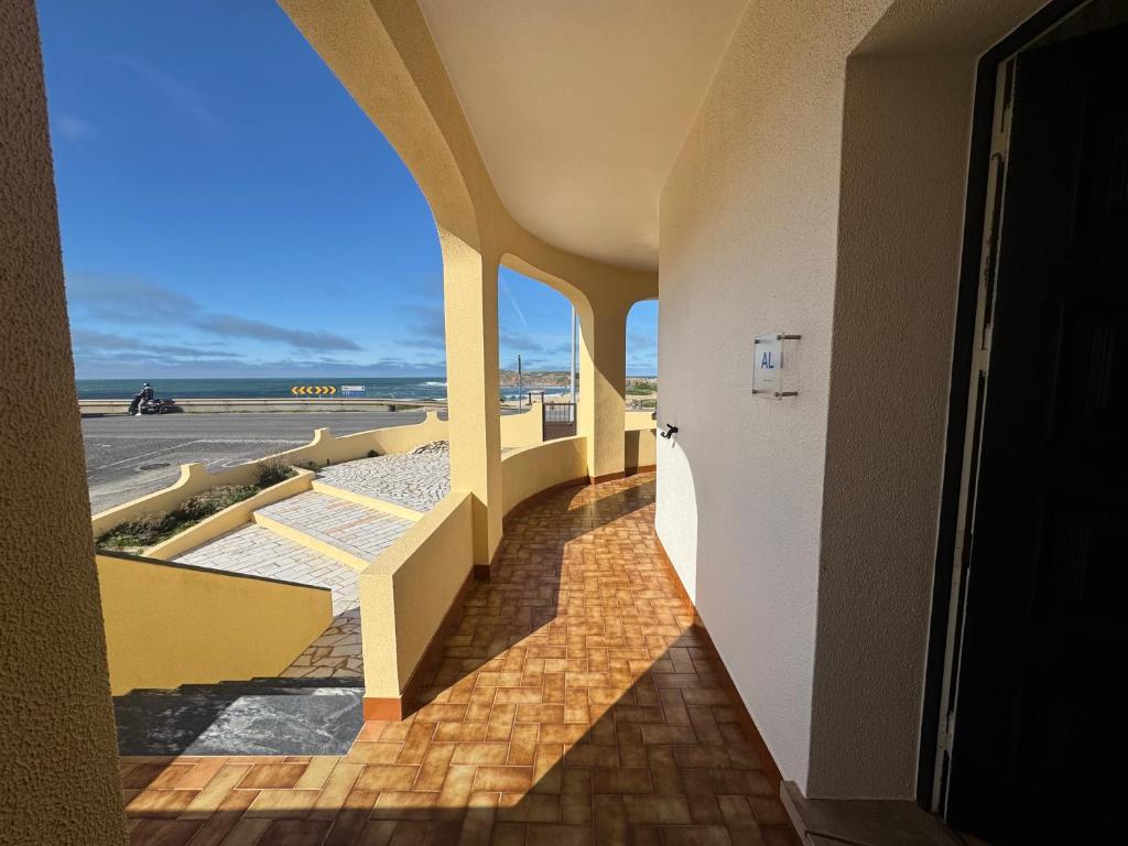 a hallway of a building with a view of the ocean at Peniche Surf & Sunset House in Peniche