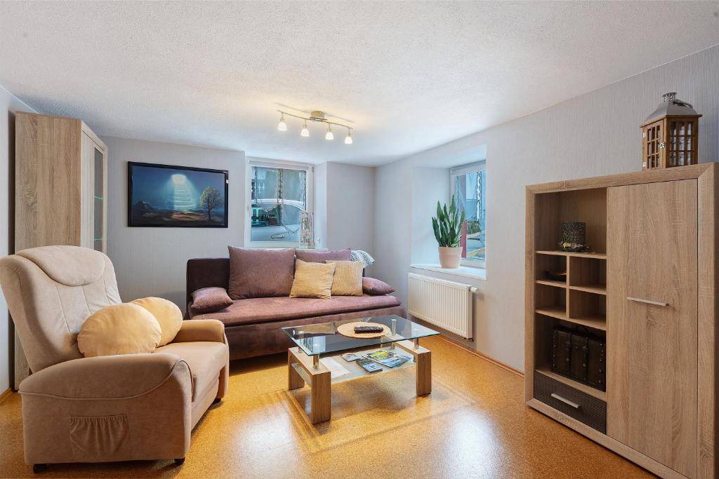 a living room with a couch and a coffee table at Ferienwohnung Schmidt in Wehr